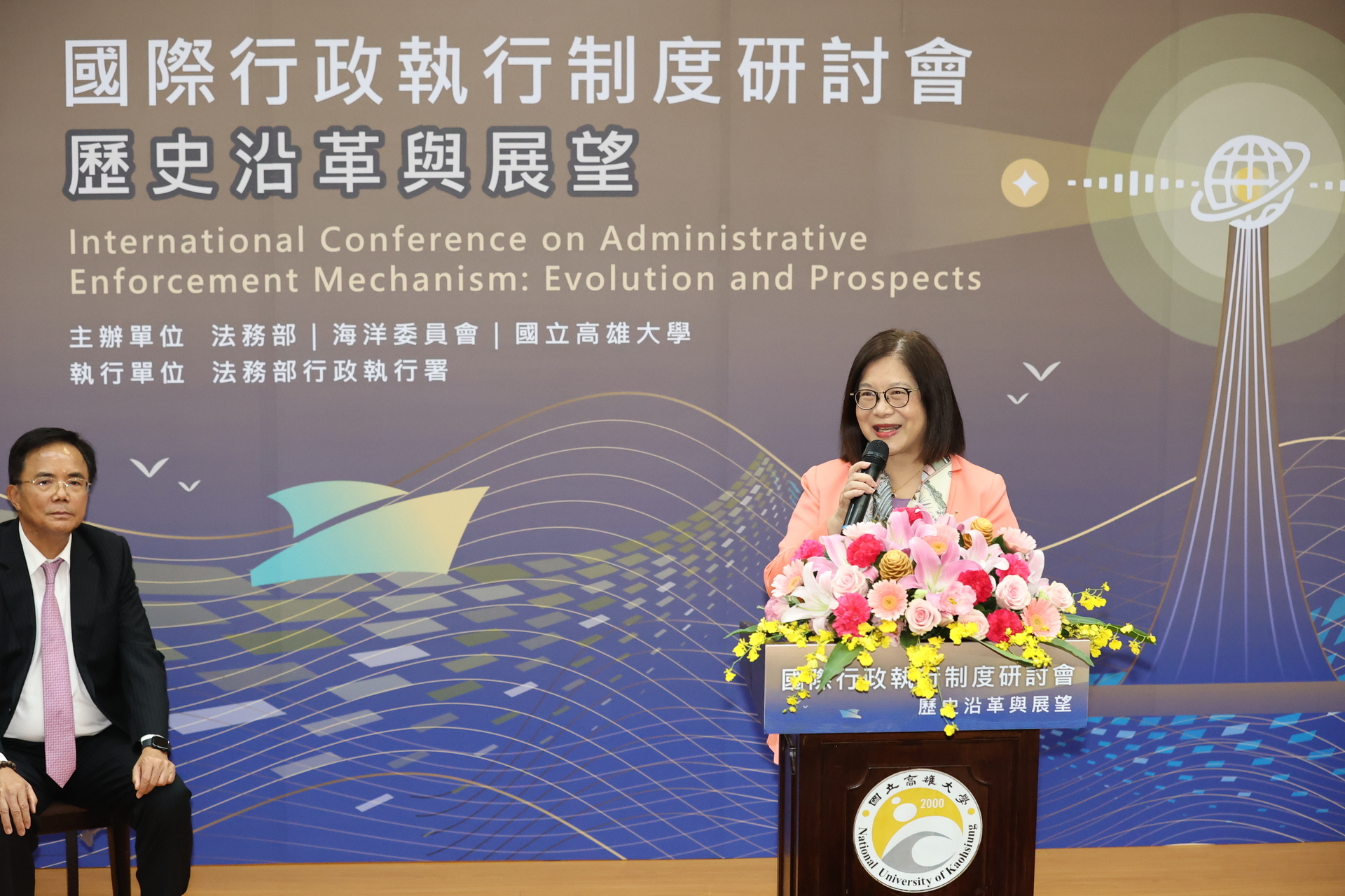 Deputy Minister of the Ministry of Justice, Bi-chung Tsai, delivers a speech.